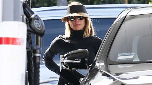 Lori Loughlin Looks Downcast While Hiding Face Under Visor After Felicity Huffman Sentencing