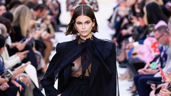 Kaia Gerber Confidently Walks Valentino Runway In Sheer Black Blouse With Nothing Beneath