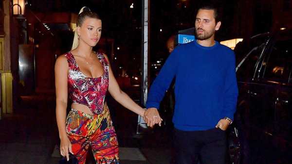 Scott Disick Gives Sofia Richie A Loving Look As She Stuns In Electric Cutout Jumpsuit & Sleek Updo