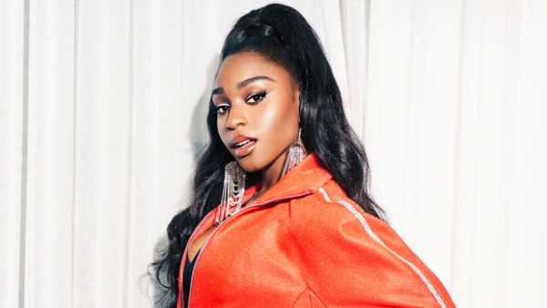 Normani Shows Off Toned Legs In Skintight Orange Bodysuit On Cover Of ‘Cosmo’ – Pics