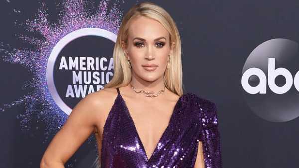 Carrie Underwood Sparkles In Purple Gown On AMAs Red Carpet