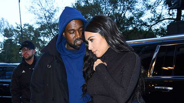 Kim Kardashian Stuns In Black Skintight Dress & Engages In Sexy PDA With Kanye West In NYC