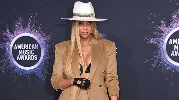 Tyra Banks, 45, Shows Off Lingerie Underneath Open Blazer On AMAs Red Carpet