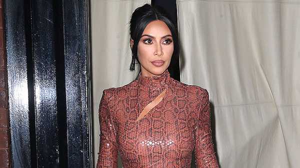 Kim Kardashian, 39, Slays In Skin-Tight Tiger Print Dress While Relaxing In Cabo — See Pics