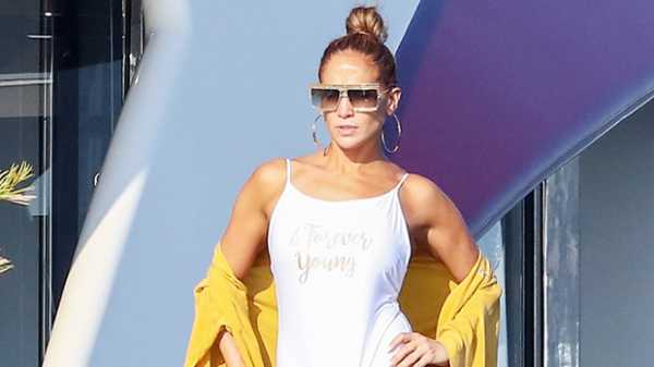 Jennifer Lopez Hits The Beach In A Sexy, White Plunging Swimsuit 