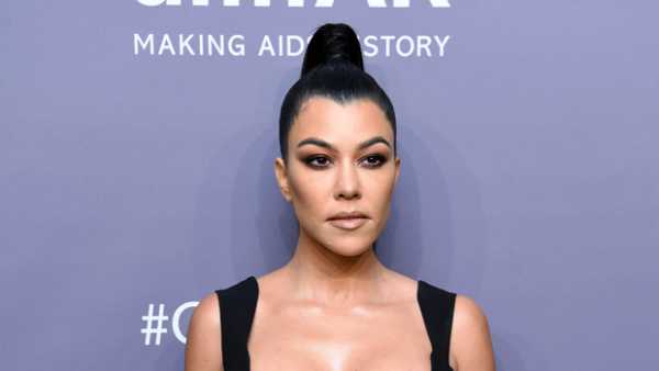 Kourtney Kardashian Stuns In Shimmery Purple Gown While Posing On A Balcony In Paris