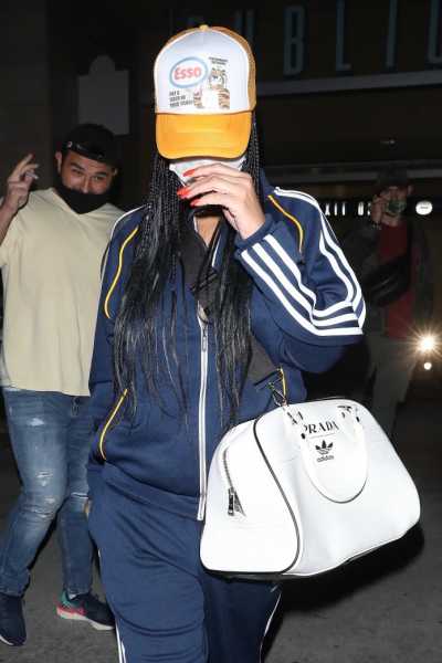 Rihanna Wears Navy Adidas Track Suit, Prada Bag, and High Heels in Los Angeles