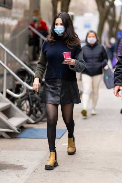 Selena Gomez Wears Leather Mini Skirt and Tricolor Sweater in New York City