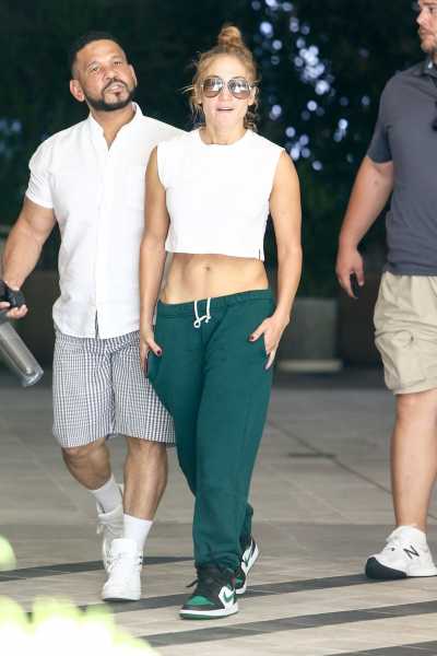 Jennifer Lopez Shows Off Her Abs on in Crop Top and Green Sweatpants