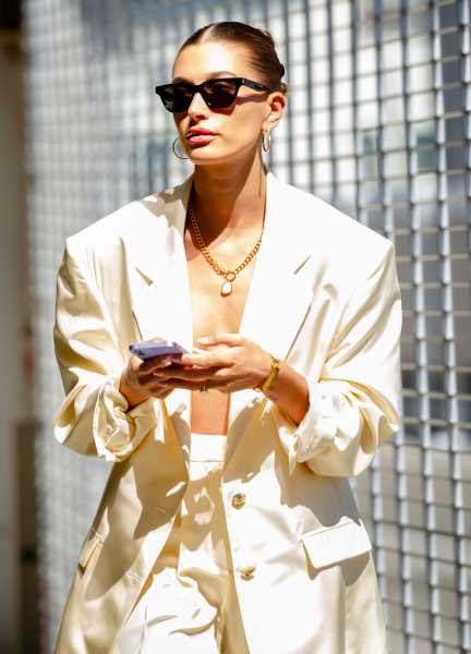 Hailey Bieber Wore an Open Blazer, Barely-There Bra, and Nikes in Los Angeles