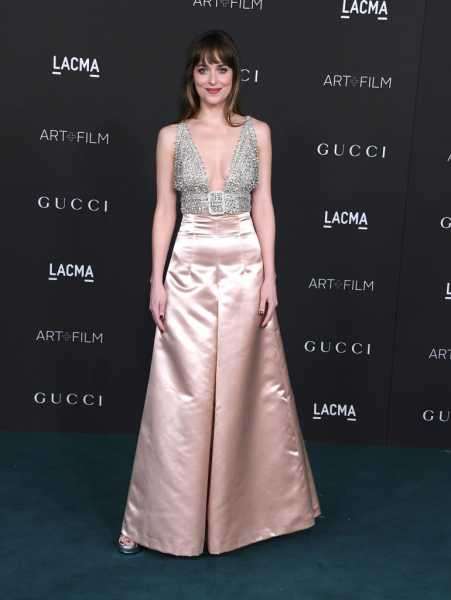 Dakota Johnson Paired a Plunge Crop Top With Satin Pants to LACMA