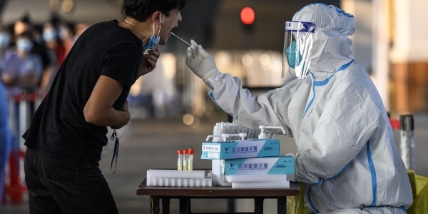 Overwhelmed by a massive outbreak, China authorizes emergency use of Merck’s COVID pill