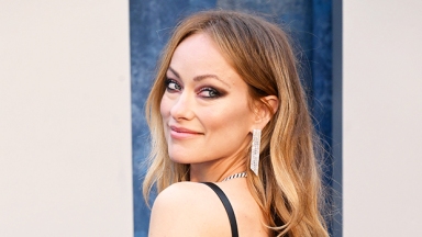 Olivia Wilde Reveals Black Leather Bra Under One-Sleeved Dress At VF Oscar Party