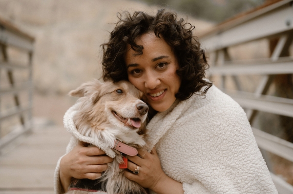 Portrait of Mariana Marquez-Farmer holding a dog.