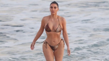 Kim Kardashian Slays Crop Top & Thong Bikini While Doing Cartwheels On The Beach: Photos