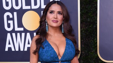 Salma Hayek Slays Plunging Black Swimsuit With Platform Stilettos While Sipping Coffee In Sexy New Photo