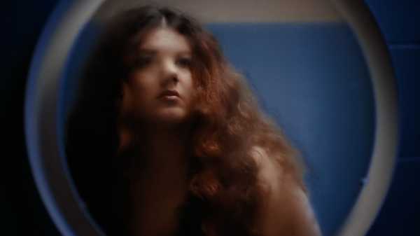 Arrested for Singing While Female, in “My Orange Garden”