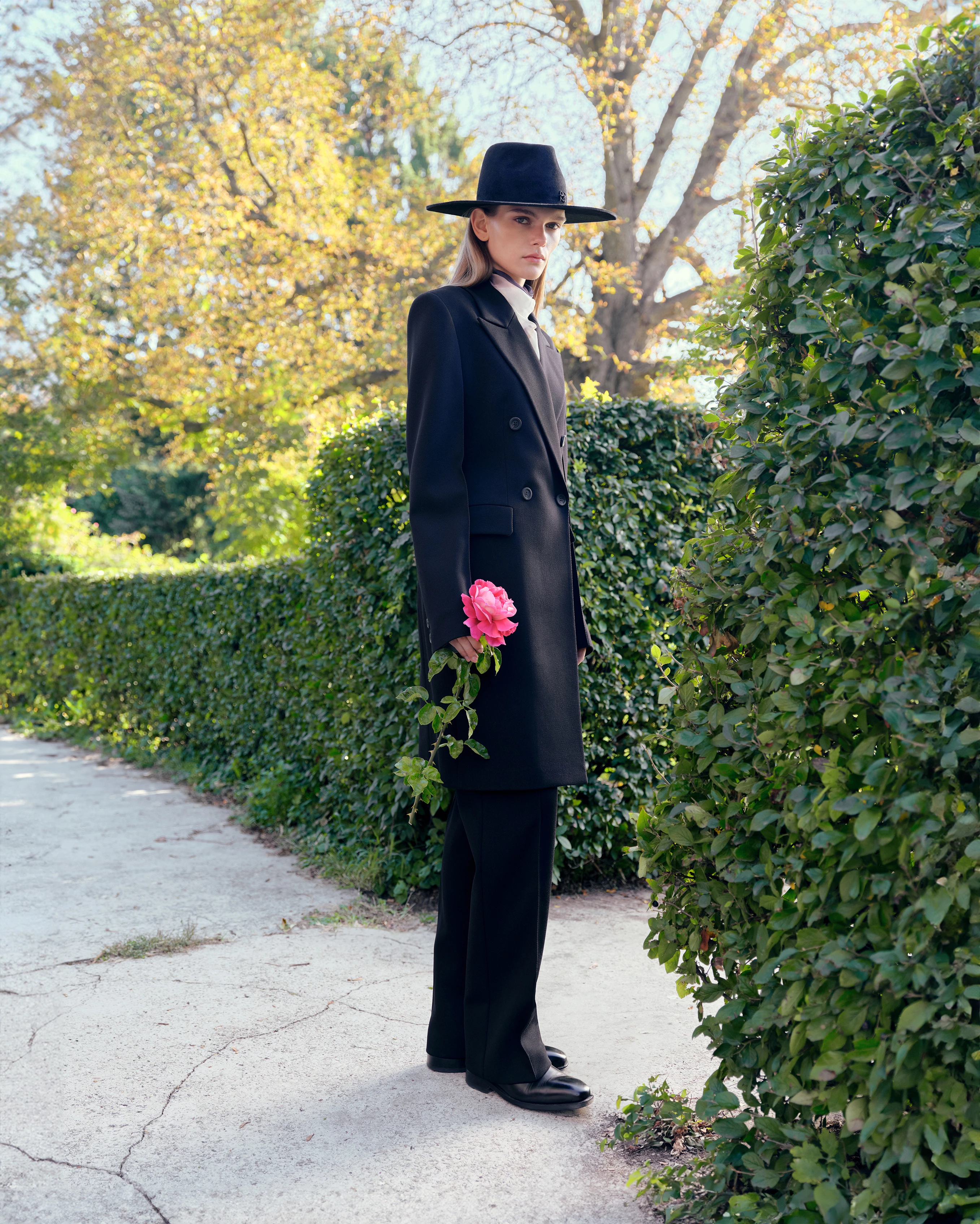 Model KAROLINA ROSSOSHANSKA, 20. Wool and polyester coat and pants, cotton shirt, all by Elenareva, Ruslan Baginskiy felt hat, and Estro leather shoes9