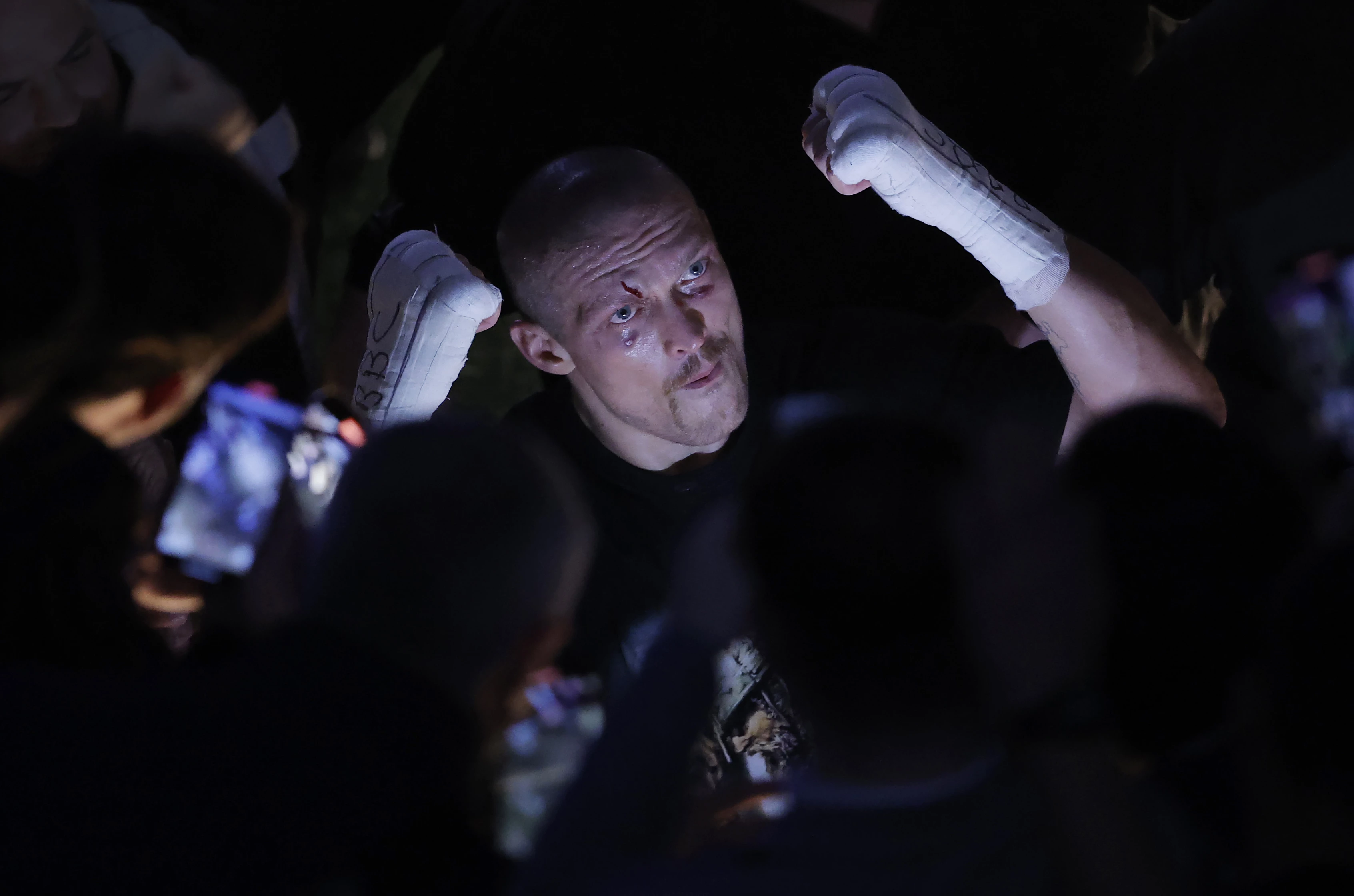 Oleksandr Usyk celebrates with fans as he returns to the locker room after defeating Anthony Joshua in a world heavyweight title fight at Tottenham Hotspur Stadium. London, United Kingdom, September 25, 202114