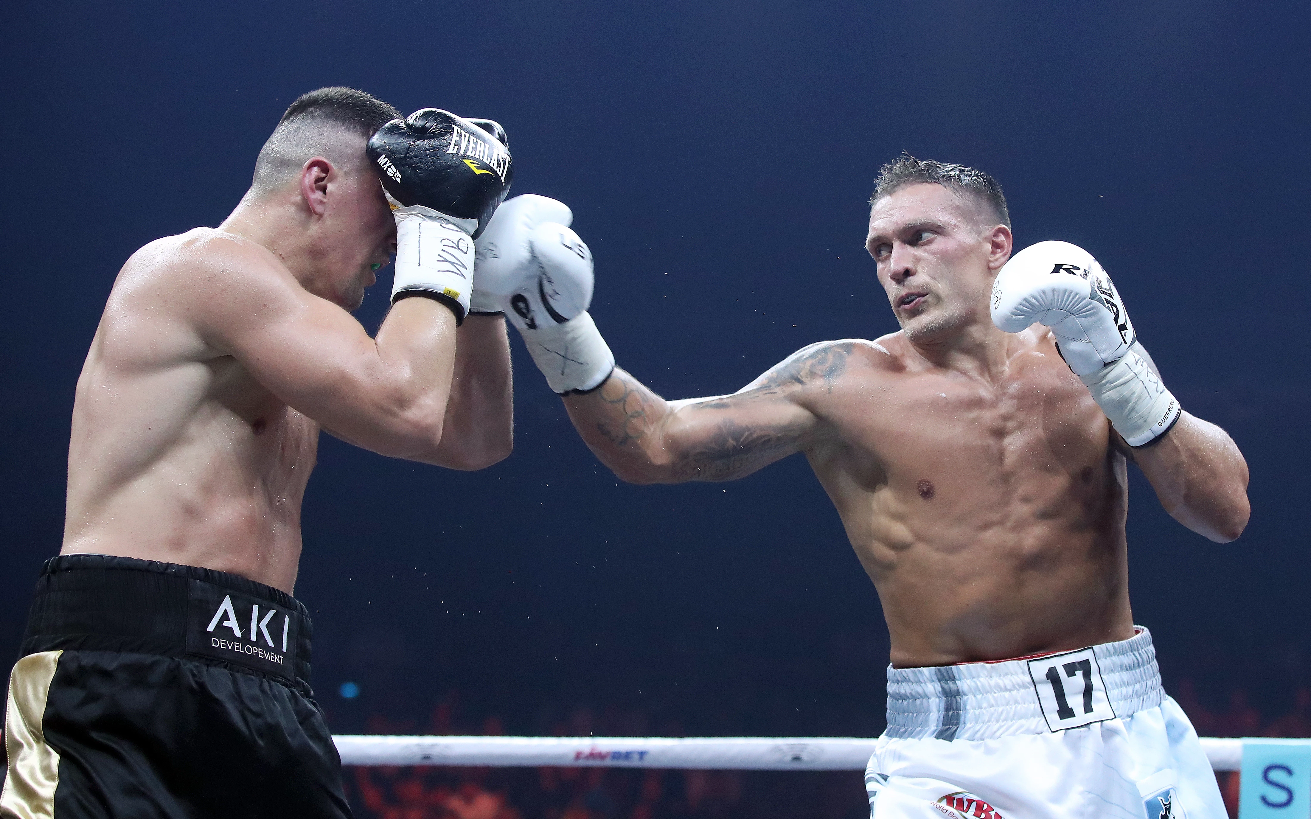 Marco Huk and Oleksandr Usyk exchange punches during their World Boxing Super Series fight for the WBO light heavyweight title at the Max-Schmeling-Halle arena in Berlin, Germany, September 9, 2017.5