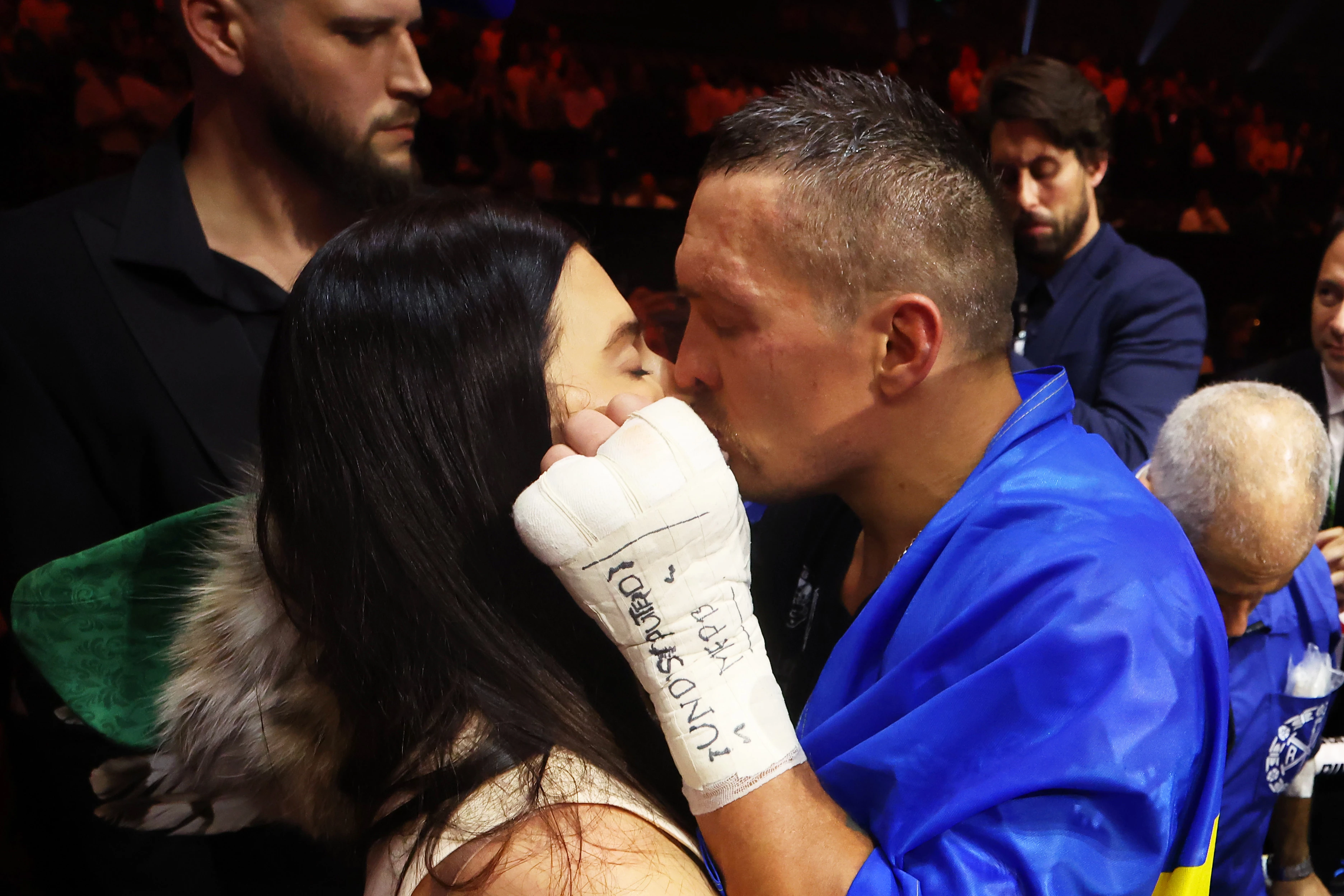 Oleksandr Usyk kisses his wife Kateryna Usyk after defeating Tyson Fury in a fight for the IBF, WBA, WBC and WBO titles and the title of absolute world heavyweight champion at the Kingdom Arena. Riyadh, Saudi Arabia, May 18, 202422
